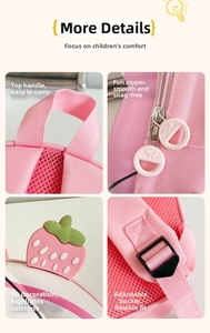 Details of pink strawberry backpack showing padded handle, dual zippers and buckles