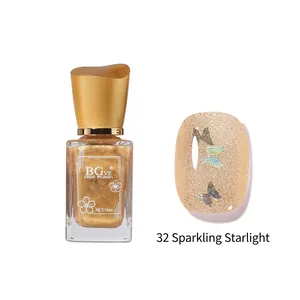 Detailed view of 32 Agile Starlight gold glitter nail polish with butterfly sequins