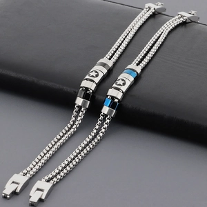 Detail of double-layer stainless steel anchor bracelet with star-patterned beads