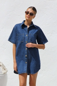 Detail of dark blue denim shirt dress featuring classic collar and button-down front