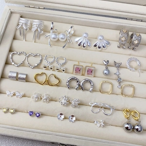 Elegant collection of S925 silver zircon butterfly and pearl earrings in a jewelry box