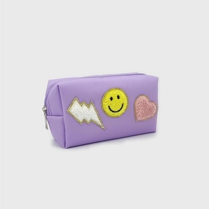 Purple PU leather pouch with chenille patches including lightning, smiley, and heart