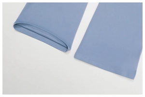 Detail shot of blue yoga flare pants showing flat edges and double-needle stitching