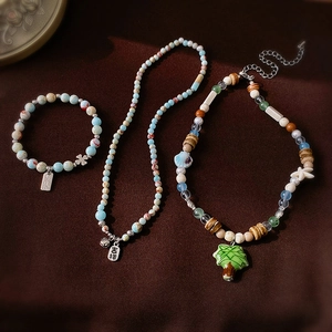 Colorful ceramic and acrylic beaded jewelry set featuring starfish and lucky square pendant