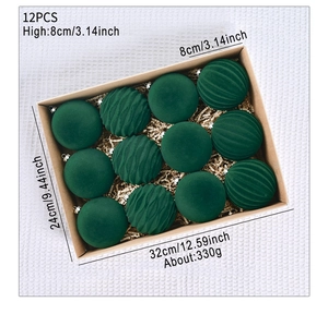 Detailed view of 12 green flocked Christmas balls in kraft box with size measurements