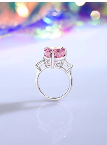 Macro shot of S925 sterling silver ring with heart-shaped pink stone and side diamonds