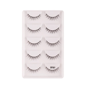 Five pairs of natural black false eyelashes set with thick volume on a white tray