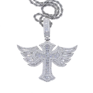 Macro shot of silver cross pendant with wings and sparkling cubic zirconia on rope chain