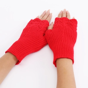 Detailed view of red knitted fingerless gloves with elegant fish scale pattern weave