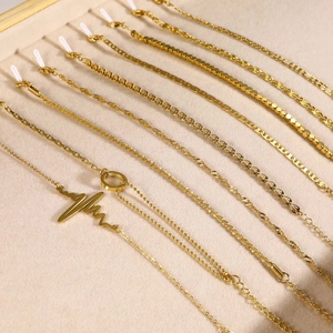 Minimalist 18K gold-plated stainless steel multi-style bracelet set in beige jewelry tray