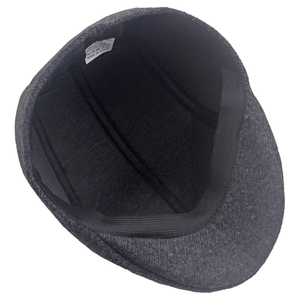 Detail of winter flat cap interior showing cotton polyester lining and washing label