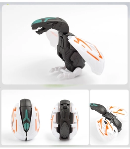 Detail view of transforming dinosaur egg toy in black and white with orange wings