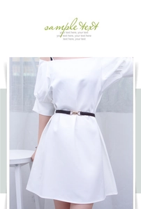 Detail of a thin black leather belt with a metal buckle on a white off-shoulder dress