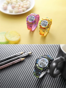 Close-up of colorful camouflage digital watches for kids showing waterproof dial details