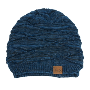 Close-up of navy blue knit beanie showing wavy texture and F&S decorative leather patch