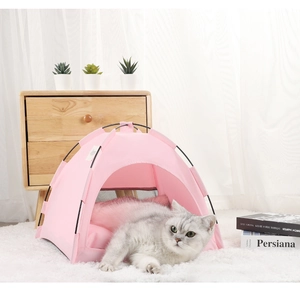 Cozy pink pet tent with soft plush cushion shown in a warm minimalist home interior