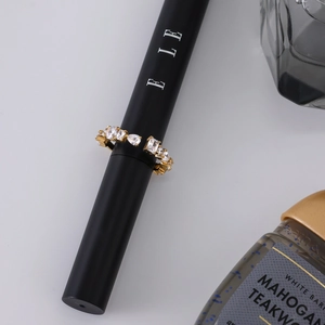 Detail view of 18K gold stainless steel open ring with mixed-cut white zirconias