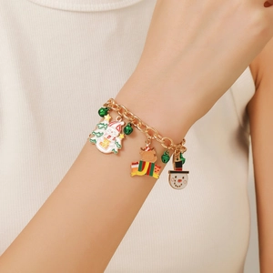 Christmas charm bracelet with snowman and reindeer pendants worn on a female wrist