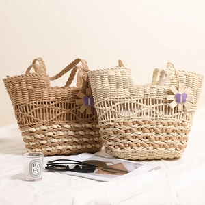 Large capacity hollow straw tote bags in light brown and cream with floral woven details