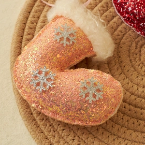 Pink sequined Christmas stocking ornament with silver snowflakes and white plush trim