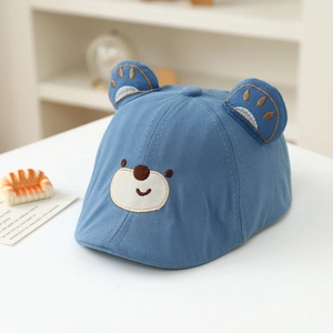Detailed view of baby beret featuring 3D bear ears and cute cartoon embroidery