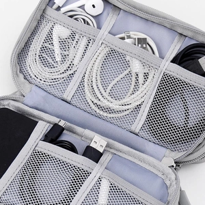 Gray digital accessory organizer bag with multiple mesh pockets and elastic straps