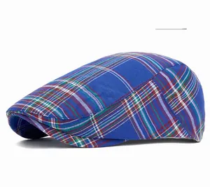 Detail of sky blue plaid newsboy cap showing classic tartan pattern and soft fabric texture
