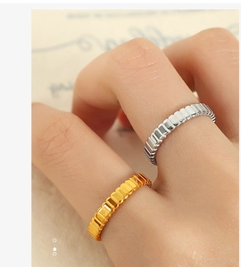 Macro view of French vintage style gold and silver titanium steel gear rings set