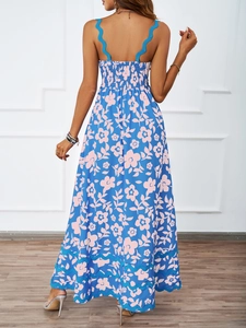 Detail of smocked elastic back and blue floral print on the summer maxi dress