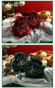 Detail of velvet Christmas drawstring gift bags with gold stars and satin bow ties