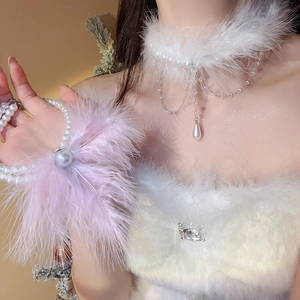 Close-up of double-layer pearl necklace with soft white feather fringe and water-drop pendant