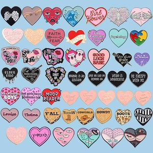Versatile geometric heart enamel pins set featuring diverse colorful metal badge designs