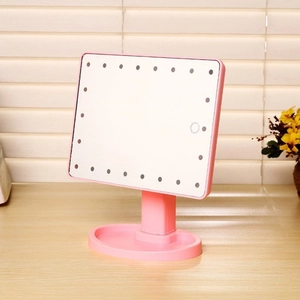 Pink desktop LED makeup mirror with 360-degree rotation and convenient storage base
