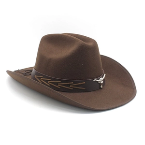 Close-up of brown felt cowboy hat featuring a leather band and silver bull head emblem
