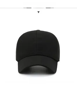 Front view of black baseball cap with fine ribbed texture and silver metal badge detail