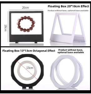 Detail view of black and white floating jewelry display boxes with flexible PE film
