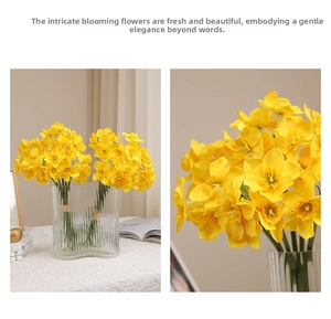 Detailed view of yellow artificial daffodils with layered petals in a ribbed glass vase