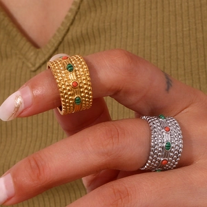Bohemian gold and silver wide rings with colorful natural stones on a female model