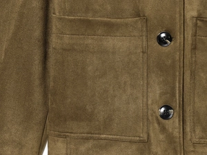 Close-up of olive green faux suede jacket showing pocket stitching and black buttons