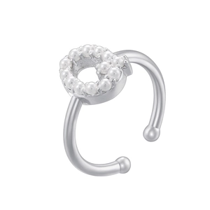 Detail of silver pearl clip earring with heart-shaped inlay and open spherical design