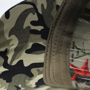 Detailed macro view of camo hat interior stitching and reinforced olive sweatband