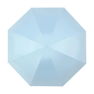 Flat lay of light blue eight-rib UV protection umbrella with waterproof fabric top view