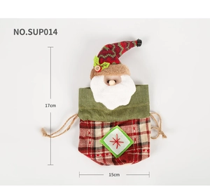 Detail of Christmas Santa drawstring gift bag with red striped hat and snowflake embroidery