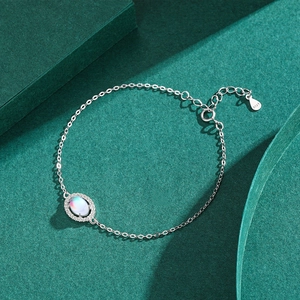 Elegant S925 sterling silver moonstone bracelet with oval gem and small diamonds