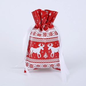 Detail of red Christmas drawstring gift bag with reindeer and snowflake patterns