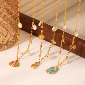 Golden stainless steel ocean theme necklace with shell, pineapple and pearl pendants