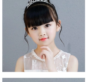 Detailed view of silver girl crown headband with sparkly rhinestones and white pearls
