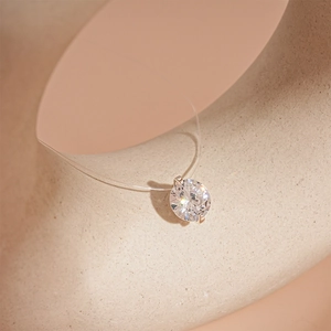 Minimalist transparent fishing line necklace with a sparkling round zircon pendant