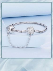 Detailed macro view of S925 sterling silver snake chain bracelet with sparkling zircon beads