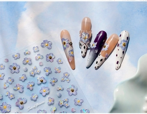 Detailed 3D relief nail stickers with purple flower patterns and iridescent finish